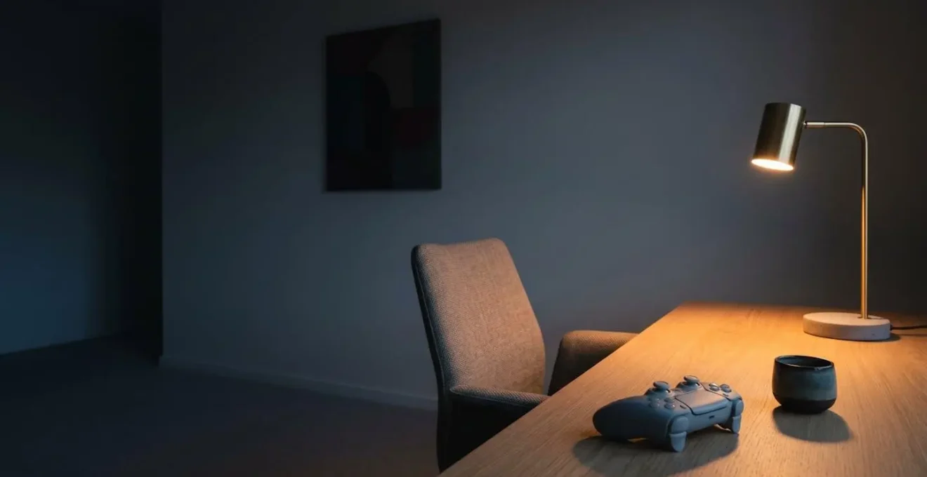 A minimalist gaming environment designed for deep immersion with focused lighting and deliberate absence of distractions